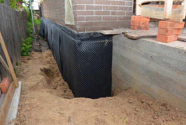 Happy homeowners after waterproofing job in West River